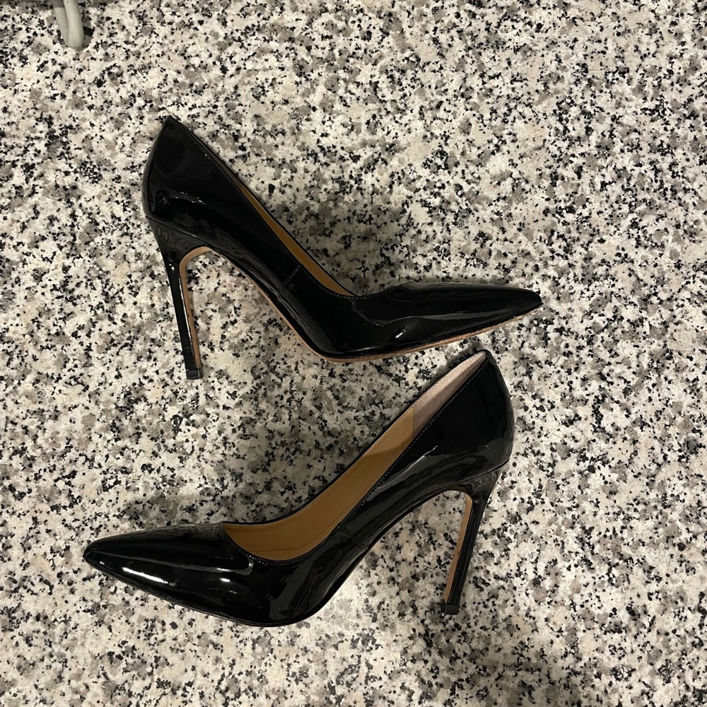 Black pointy toe pumps